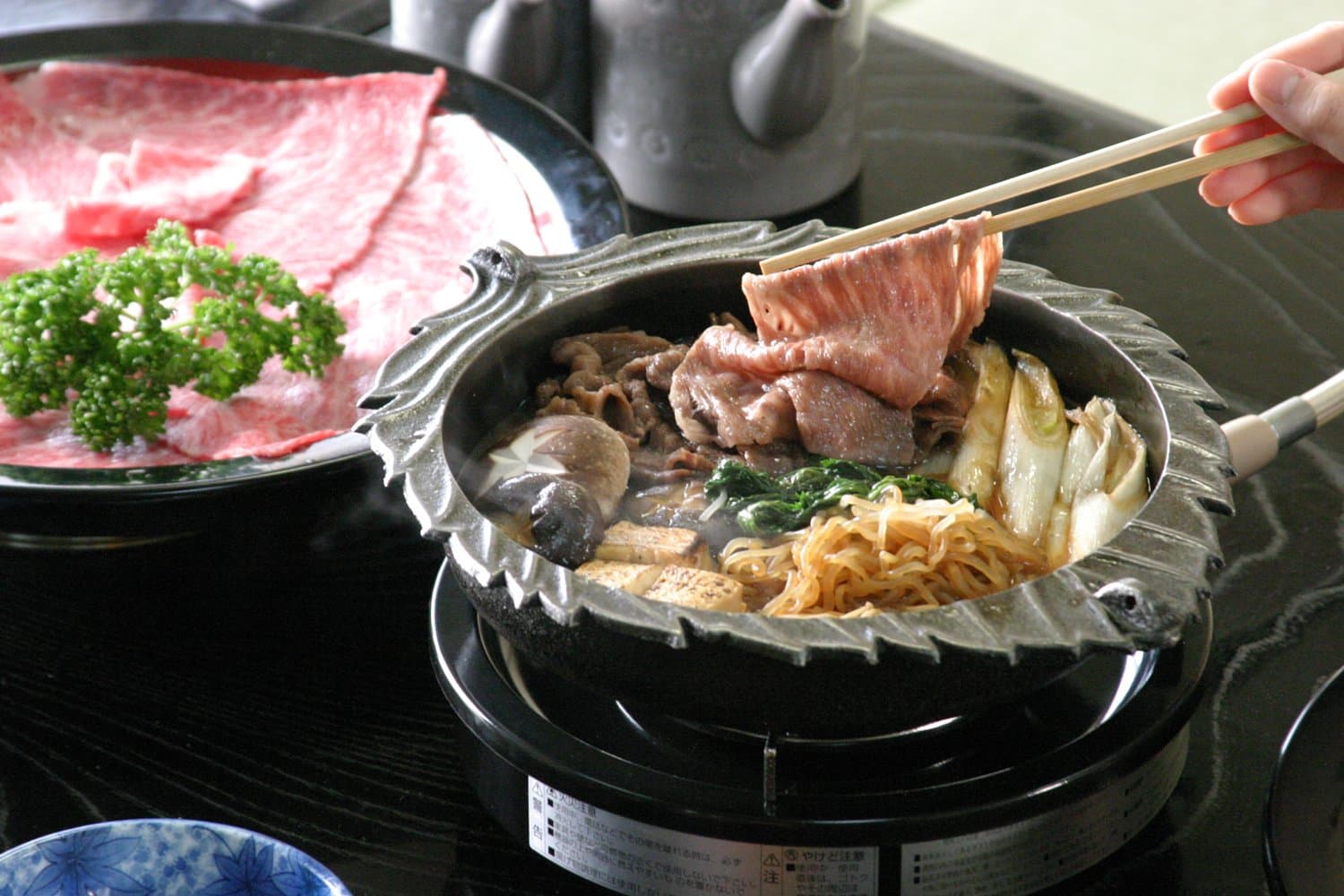A single-serving sukiyaki hot pot of Joshu wagyu beef with vegetables and tofu