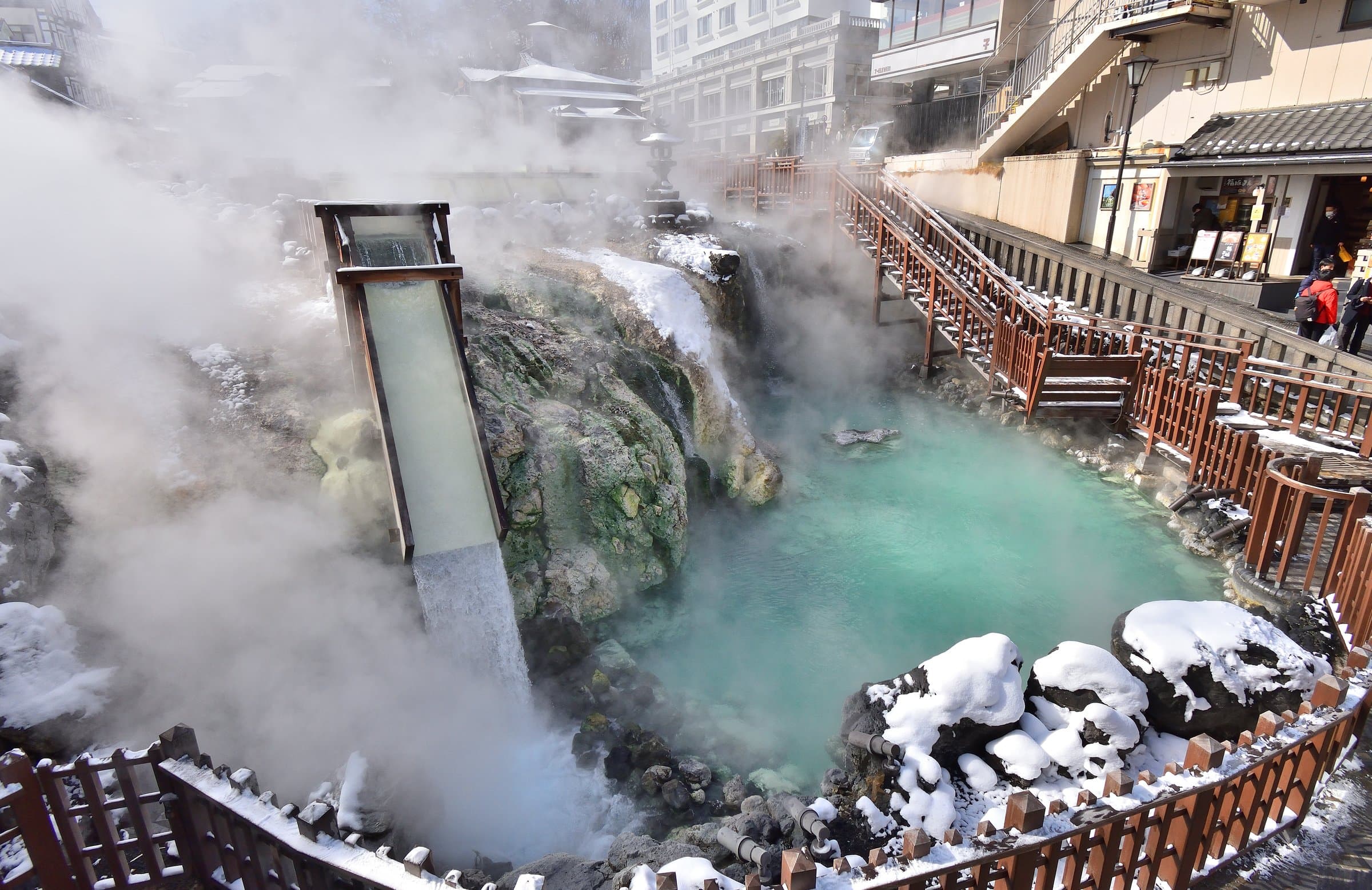The Yubatake hot-water field steaming amid snow in winter, Kusatsu